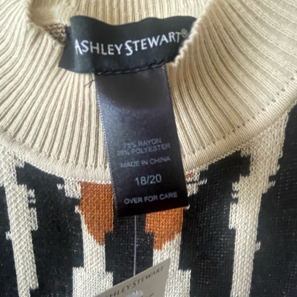 An abstract design creates a fun motif create this sweater dress. - Picture 2 of 5